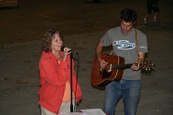 Janet Barrier sings country while sons play.